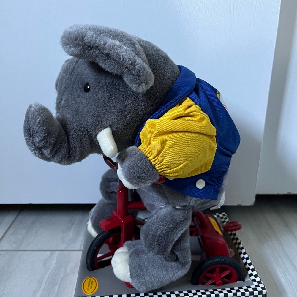 Rare happiness express club elephant on tricycle. Musical Pedaler